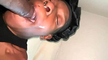 She's got a big black guy on her face