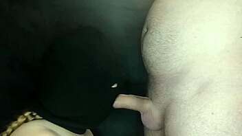 my step sister's hot mouth sucks my cock while her face is hidden by a balaclava. she moans during the sloppy blowjob.