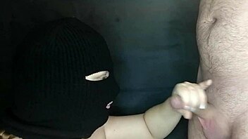 my step sister's hot mouth sucks my cock while her face is hidden by a balaclava. she moans during the sloppy blowjob.