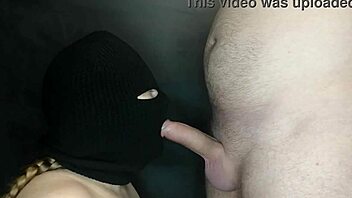 my step sister's hot mouth sucks my cock while her face is hidden by a balaclava. she moans during the sloppy blowjob.