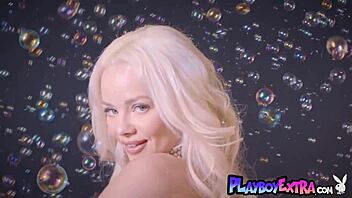 petite blonde teen elsa jean strips naked and poses seductively in martini glass