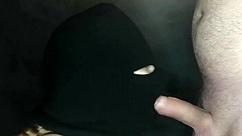 my step sister's hot mouth sucks my cock while her face is hidden by a balaclava. she moans during the sloppy blowjob.