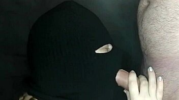 my step sister's hot mouth sucks my cock while her face is hidden by a balaclava. she moans during the sloppy blowjob.