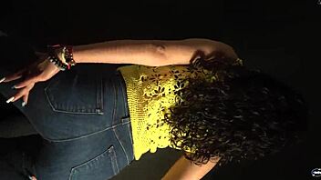 moving butt to music in sexy outfit with long nails