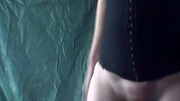 Blonde performs striptease while dancing