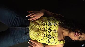 moving butt to music in sexy outfit with long nails