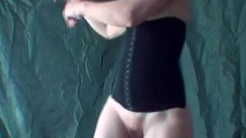 Blonde performs striptease while dancing