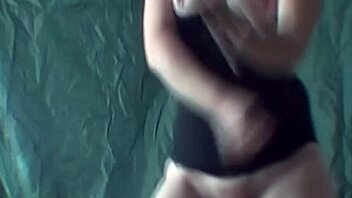 Blonde performs striptease while dancing