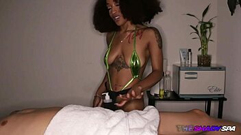 Masseuse in black lingerie caresses and jerks the cock in parlor