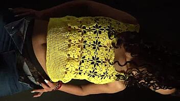 moving butt to music in sexy outfit with long nails