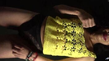 moving butt to music in sexy outfit with long nails