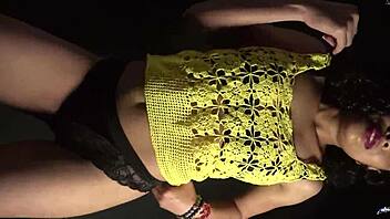 moving butt to music in sexy outfit with long nails