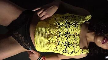 moving butt to music in sexy outfit with long nails