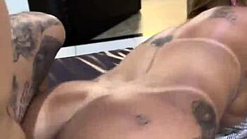 milf with big ass sits on tattooed guy's cock