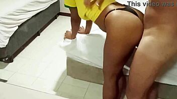 latina wife has fun with lover while husband watches football