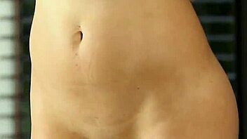 the MILF MODEL with BIG ROUND ASS wears BLACK STOCKINGS while UNDRESSING