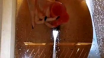 Girl with appetizing ass plays in shower with pink dildo. Clothes get ripped during homemade fun.