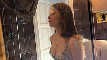 Petite college cheerleader teases in bathroom. She strips panties to reveal under her miniskirt.