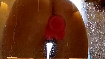 Girl with appetizing ass plays in shower with pink dildo. Clothes get ripped during homemade fun.