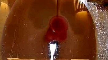 Girl with appetizing ass plays in shower with pink dildo. Clothes get ripped during homemade fun.