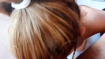 tattooed colombian woman receives a gift in her mouth