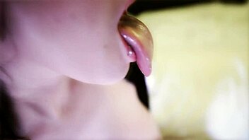 Scarlett Diablo strips and teases solo on her bed.