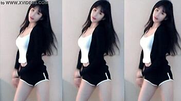 Cute Chinese girl dances wildly in stunning tight outfit
