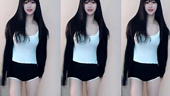 Cute Chinese girl dances wildly in stunning tight outfit