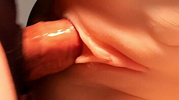 Sliding my cock into her shaved pussy from behind