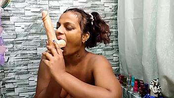 Sheron Enjoys Dildo Fun with Saliva in a Golden Bath