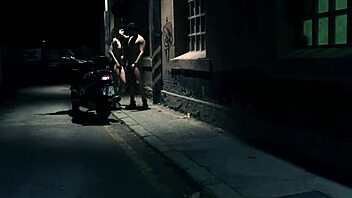 Nighttime street action with intense pounding under the open sky.