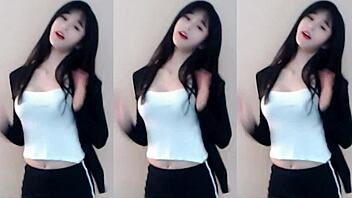 Cute Chinese girl dances wildly in stunning tight outfit