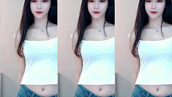 Cute Chinese girl dances wildly in stunning tight outfit