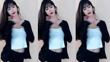 Cute Chinese girl dances wildly in stunning tight outfit