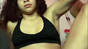 horny latina stretches and shakes her ass on the bed