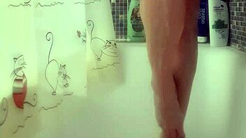 Busty teen washes perfect feet in shower