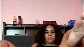 horny latina stretches and shakes her ass on the bed