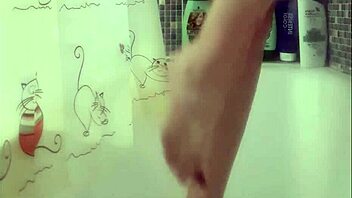 Busty teen washes perfect feet in shower