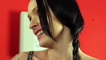 A groupie gives a sloppy blowjob in the shower with cumshot