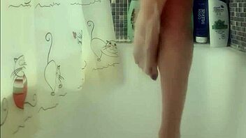 Busty teen washes perfect feet in shower