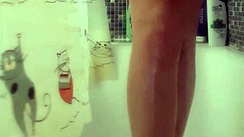Busty teen washes perfect feet in shower