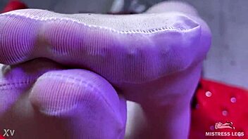 Goddess teases with big booty and feet in white stockings on red couch 😍