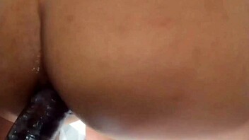 the venezuelan girl is spending time with two friends on the sofa at home in a relaxed setting