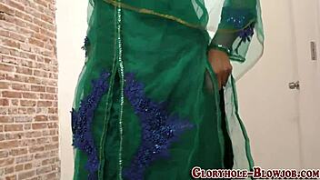 arab babe eagerly sucks massive black cock at gloryhole, getting facial cumshot