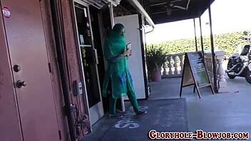 arab babe eagerly sucks massive black cock at gloryhole, getting facial cumshot