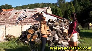 Outdoor threesome involves watersports and blowjobs