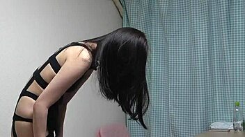 Akane Iruma strips off lingerie and slips into fishnets on webcam.