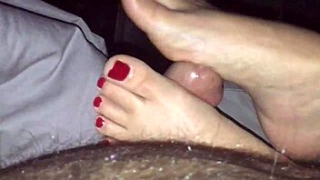 Milf gives detailed footjob with sexy painted red toes leading to cumshot.