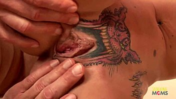 Skinny blonde with pussy tattoo gets creampie on red couch