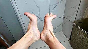 Young babe with sexy long legs sucks my dick with her feet
